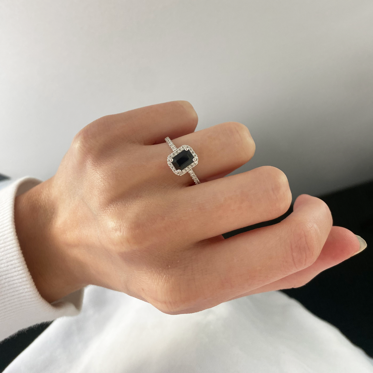 18ct White Gold Emerald Cut Sapphire Ring With Diamond Halo & Shoulders