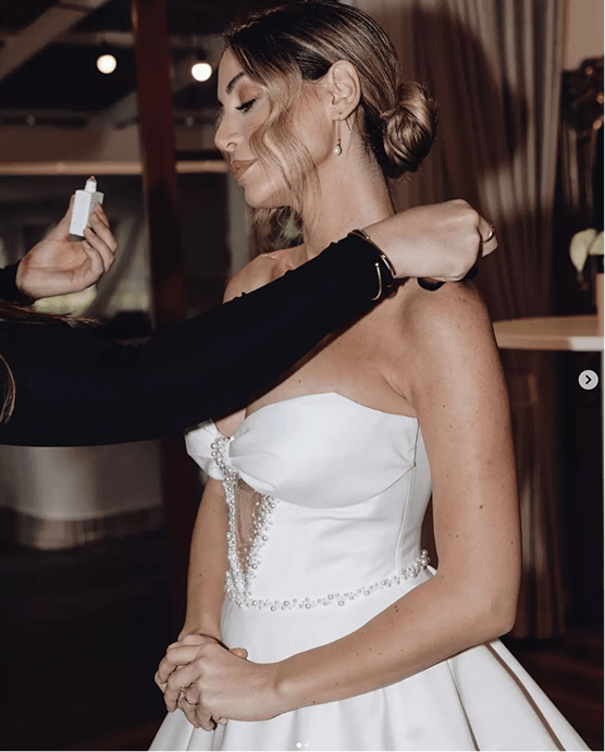 Bride getting ready with pearl earrings