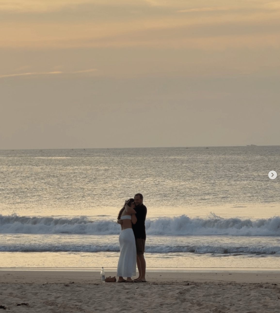 Beach proposal moment at sunset
