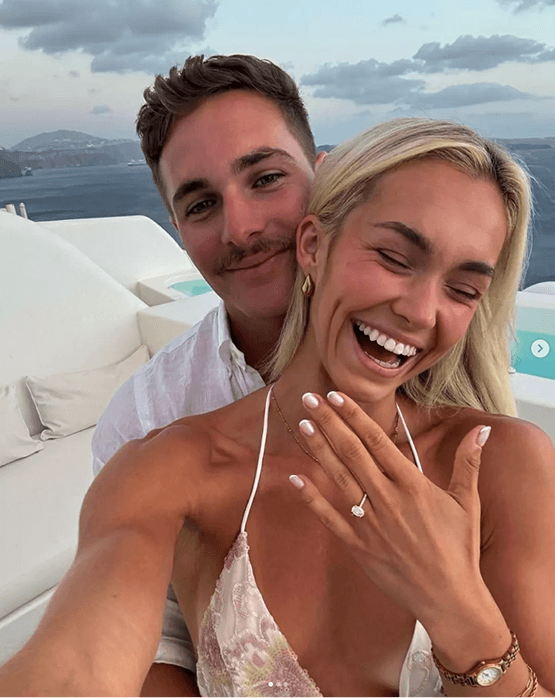 Happy engaged couple selfie with ring