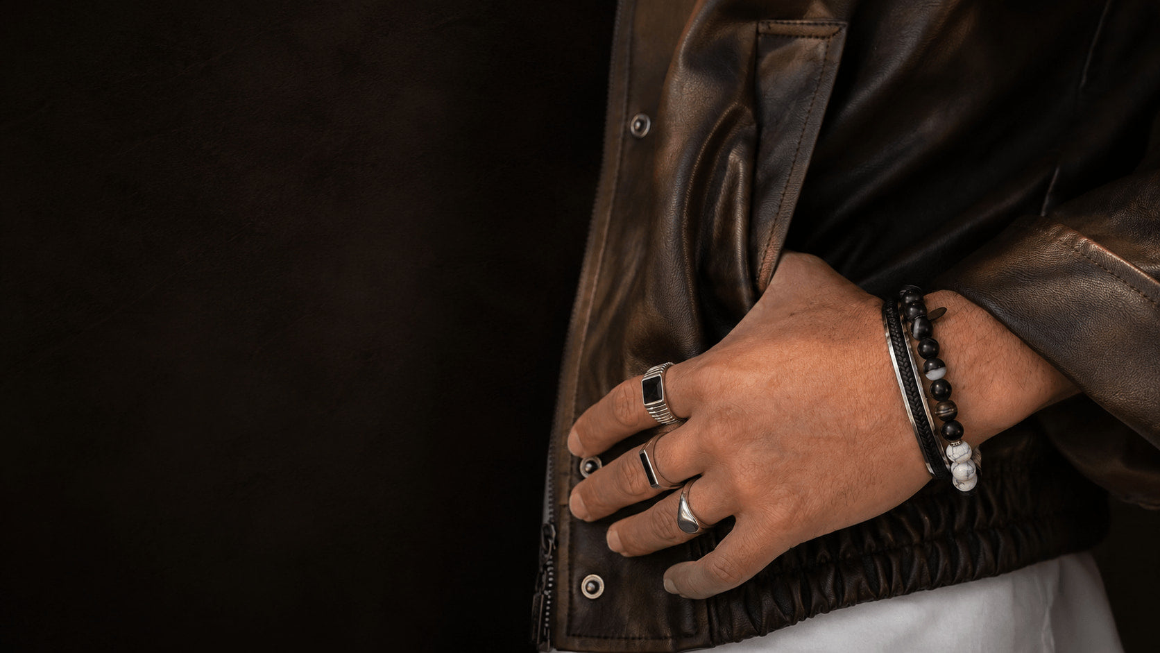 A man wearing rings and bracelets from the My Jewellery Shop men's collection